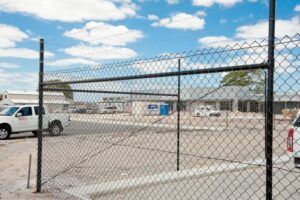 PVC black Railless Chain mesh fencing with 3 x rows of barbed wire 2